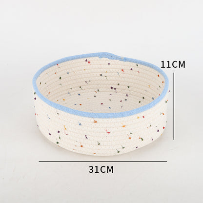 Storage basket made of natural cotton fabric with colorful dots