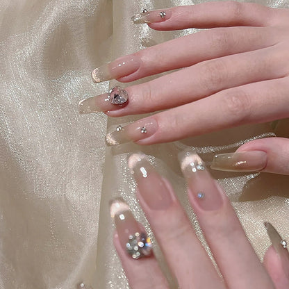 Acrylic nail set with glamorous glitter accents and elegant jewelry embellishments Acalora