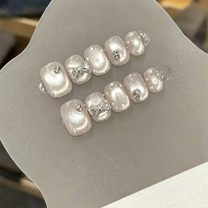 Artificial nail set with elegant glitter and crystal decorations Acalora