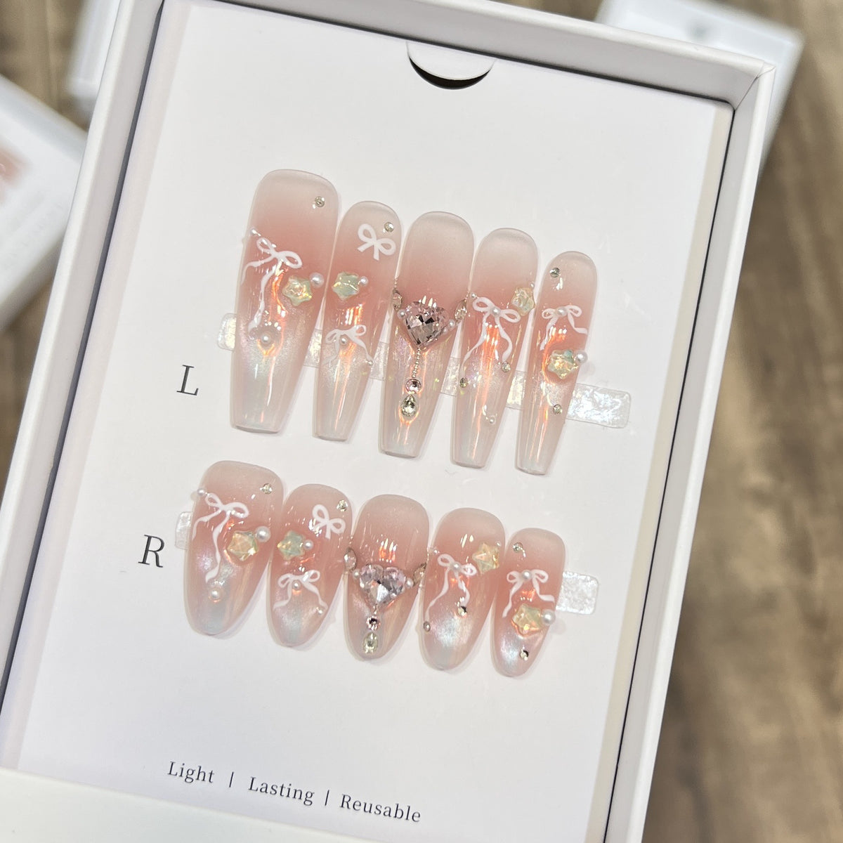 Elegant Press-On Nail Art Set with Chic Ribbon and Gem Accents Acalora