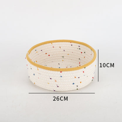 Storage basket made of natural cotton fabric with colorful dots