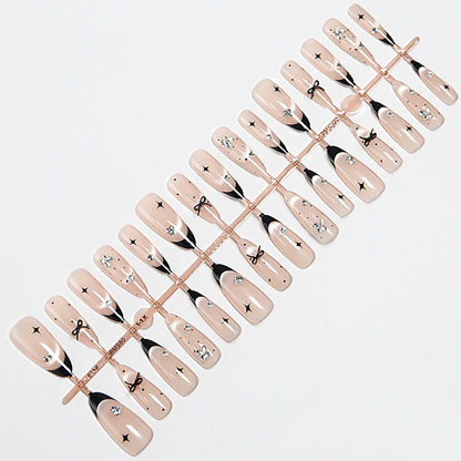 Nail art set with elegant black and white design and sparkling applications Acalora