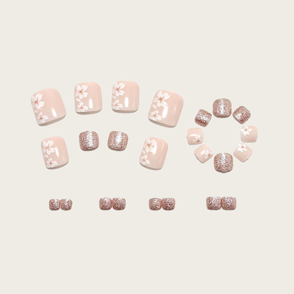 Artificial nail set with floral and glittering accents Acalora