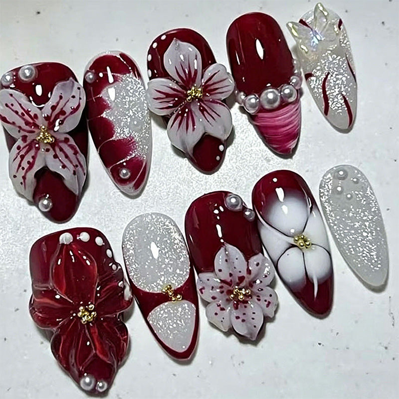 Artificial nail set with glamorous floral designs and creative glitter accents Acalora