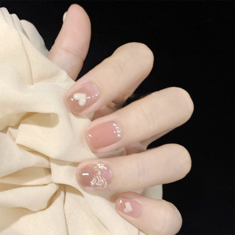 Artificial nails with romantic hearts and glitter accents Acalora