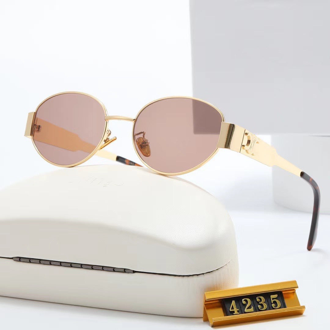 Women's elegant oval sunglasses with gold-colored frame Skanto