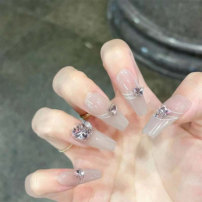Art nail set with filigree decorations and glamorous accents Acalora
