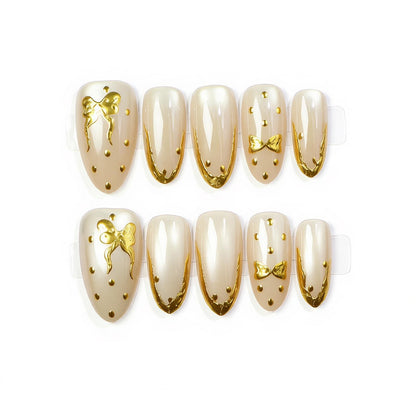 Elegant Press-On Nail Art with Golden Bow Accents Acalora