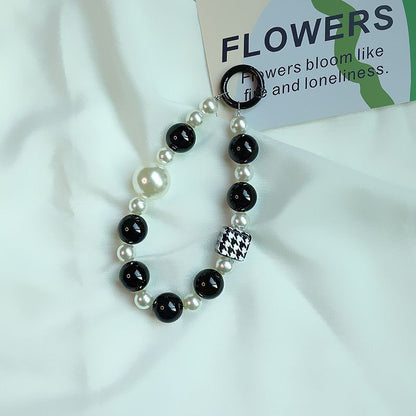 Elegant Pearl and Black Bead Charm Bracelet Acalora