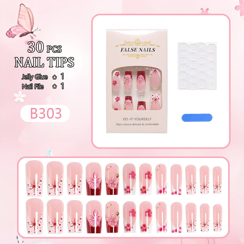 Artificial nail set with floral detail and glitter effects Acalora