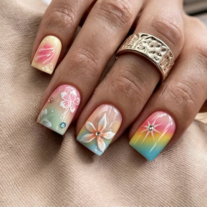 Artificial nails in vibrant floral design with glitter accents Acalora