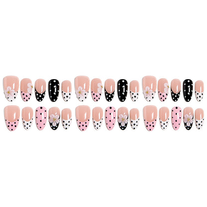 Nail art set with floral accents and elegant dots Acalora
