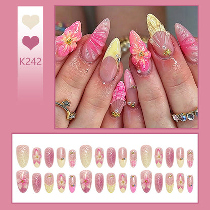Art nail set with filigree flower decorations and glitter elements Acalora