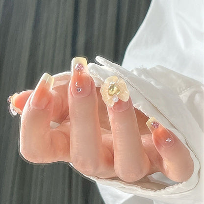 Artificial nail set with elegant floral decorations and glitter accents Acalora