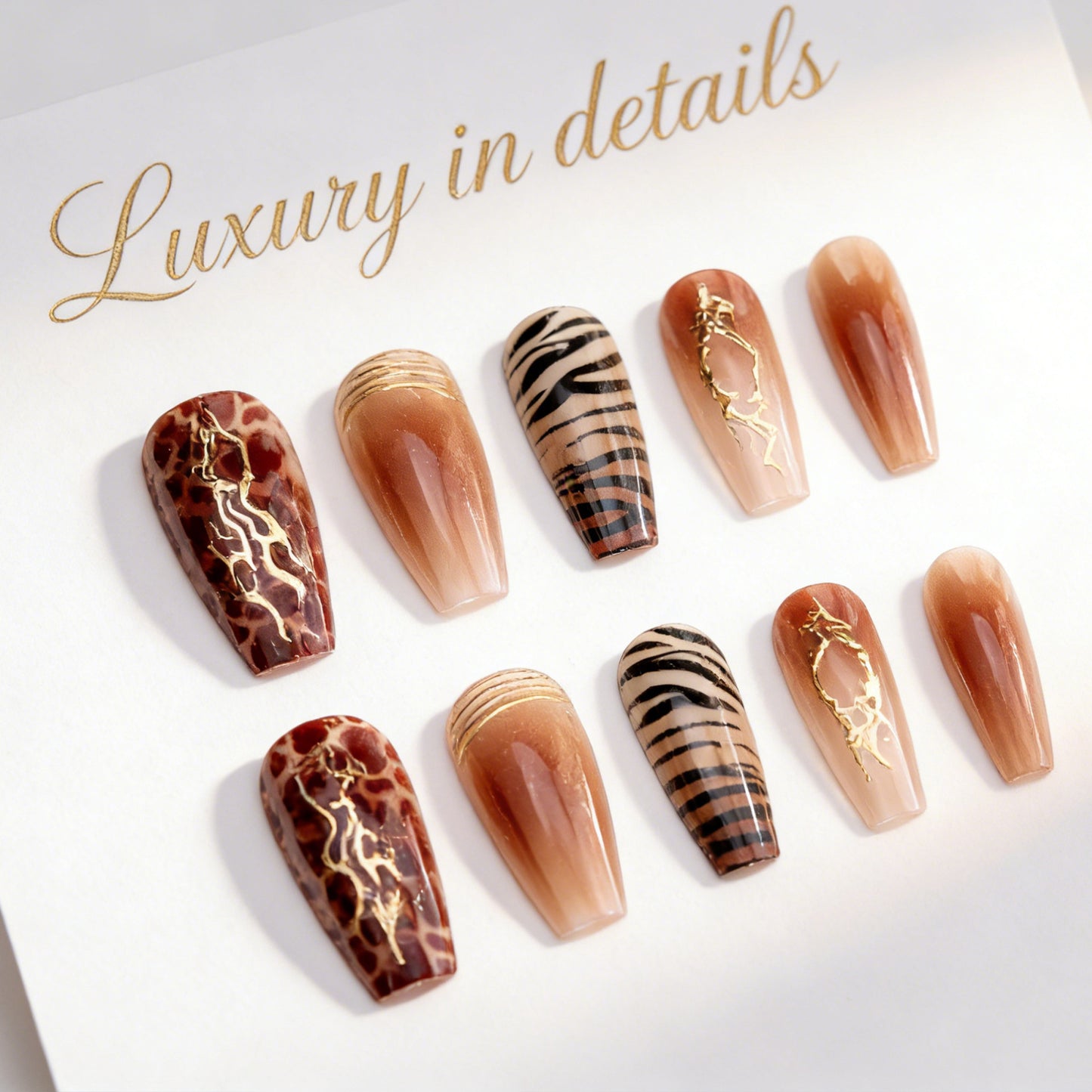 Acrylic nail set with glamorous golden accents Acalora