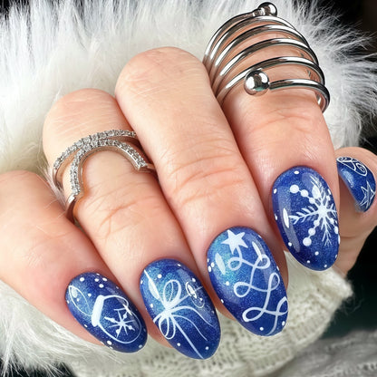 Artificial nails in festive winter design with glittering snowflakes and elegant decorations Acalora