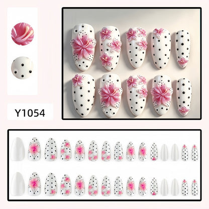 Artificial nail set with floral accents and polka dots Acalora