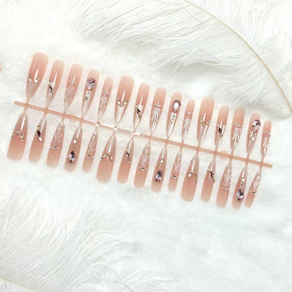 Artificial nails with glamorous crystal embellishments Acalora