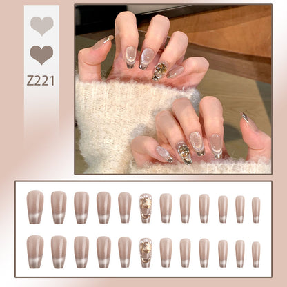 Artificial nail set with glamorous gold and glitter accents Acalora