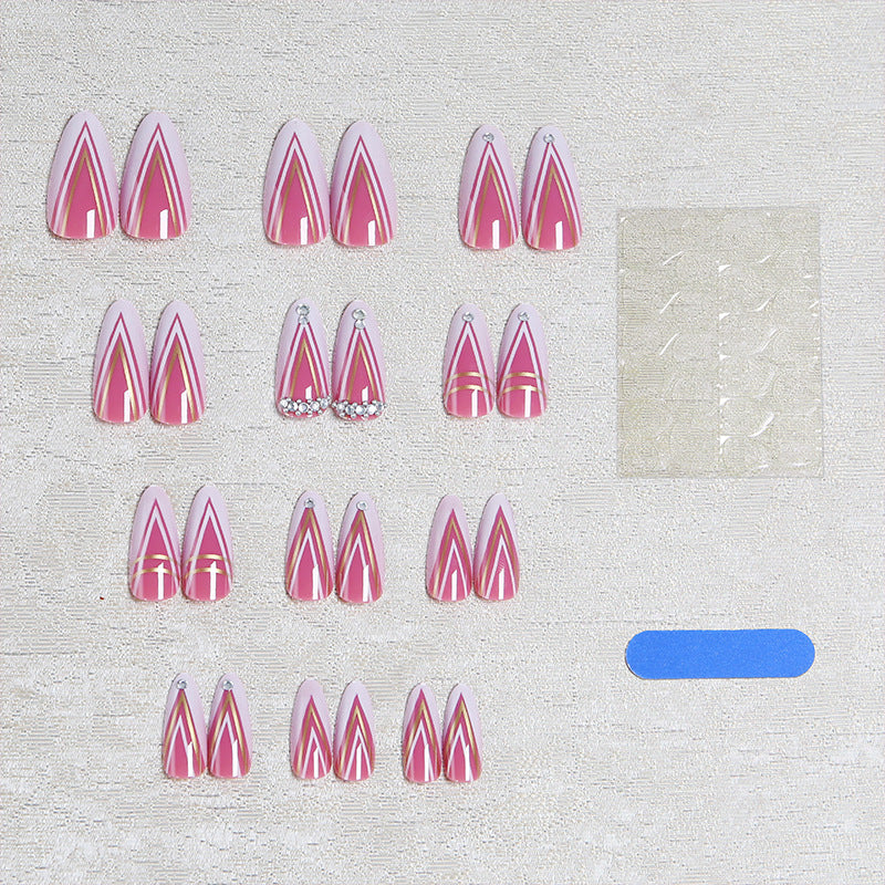 Acrylic nail set with elegant stiletto shape and luxurious embellishments Acalora