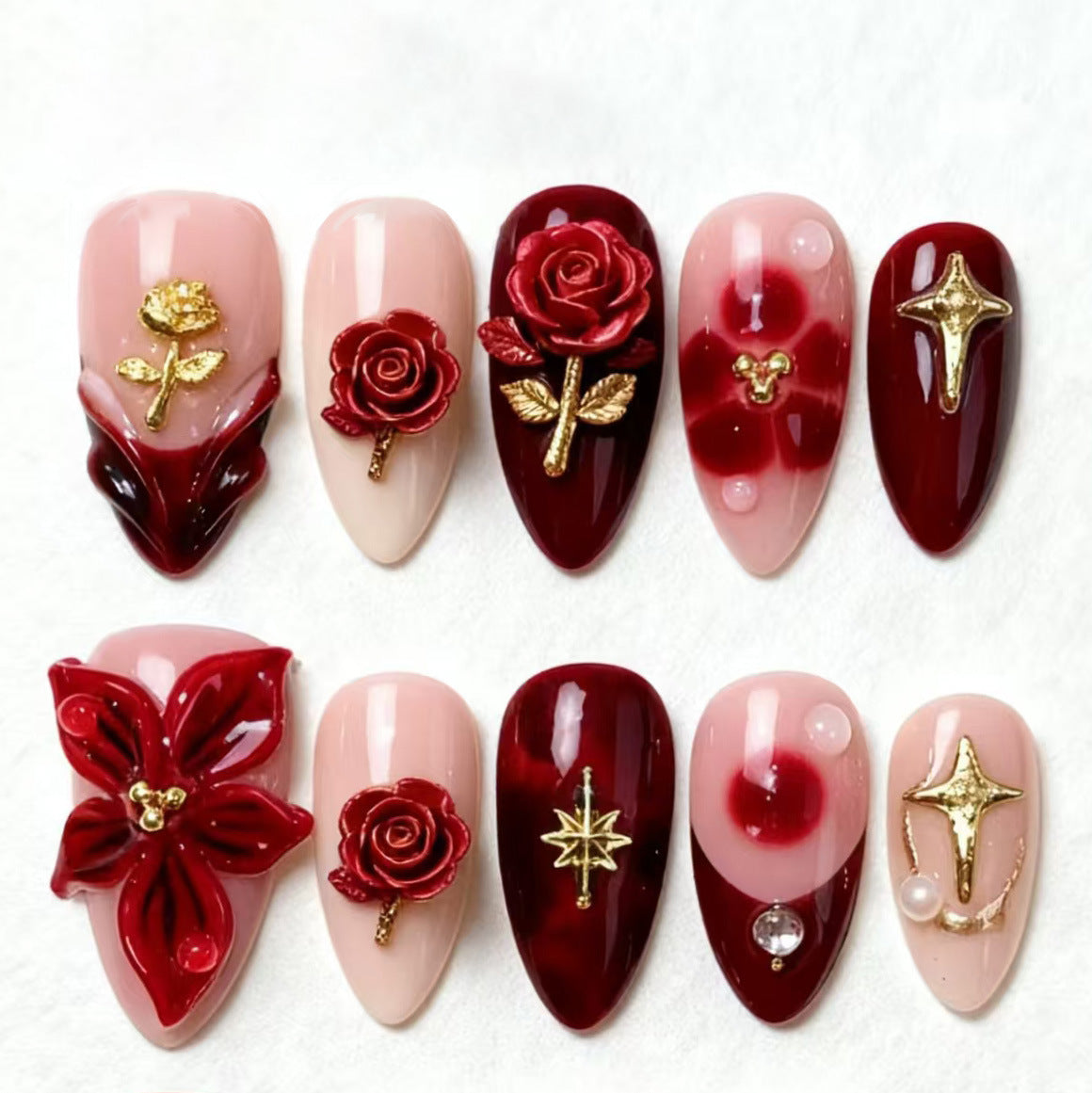 Artificial nail set with elegant floral applications and glamorous accents Acalora