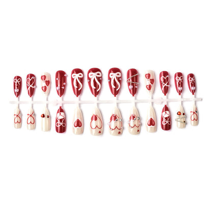 Glamorous artificial nail set with romantic heart design and elegant embellishments Acalora