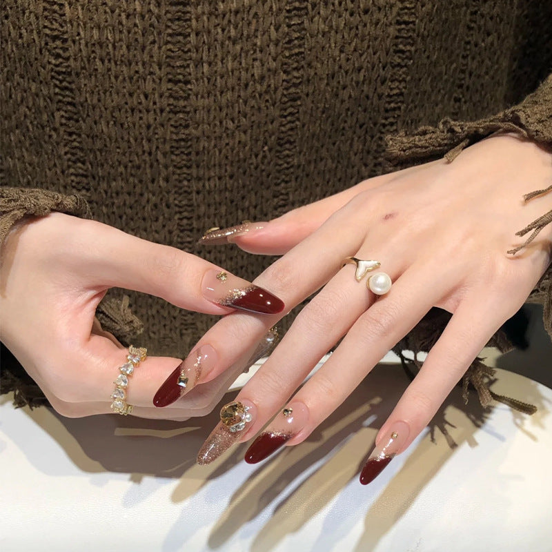 Acrylic nail set with elegant glitter design and exclusive embellishments Acalora