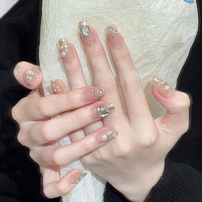 Artificial nail set with elegant pearl and glitter design Acalora