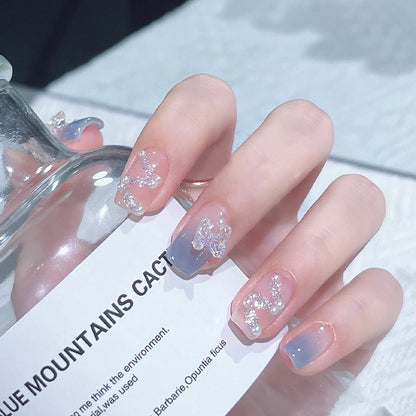 Acrylic nail set with sparkling glitter elements and appealing ombre design Acalora