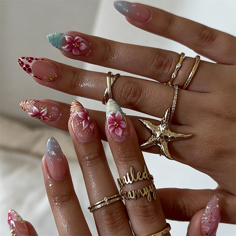 Artificial nail set with floral designs and glamorous accents Acalora