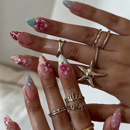 Artificial nail set with floral designs and glamorous accents Acalora