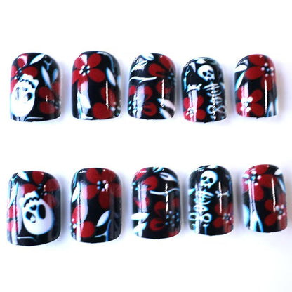 Artificial nail set with creepy skull design and floral accents Acalora