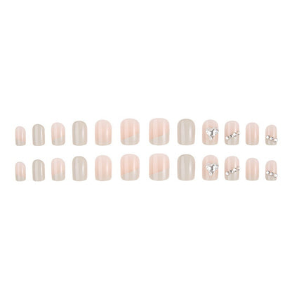 Glamorous artificial nails with heart and rhinestone decorations Acalora