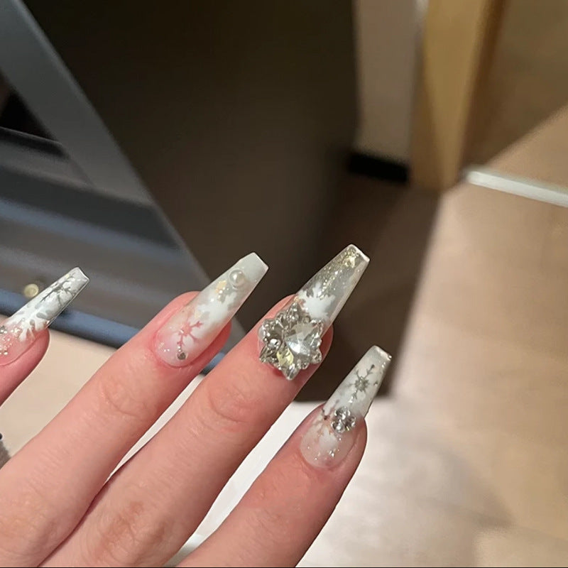 Artificial nail set with frosty snowflake design and sparkling 3D applications Acalora
