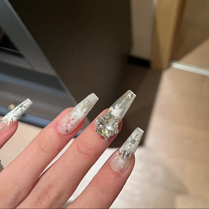Artificial nail set with frosty snowflake design and sparkling 3D applications Acalora