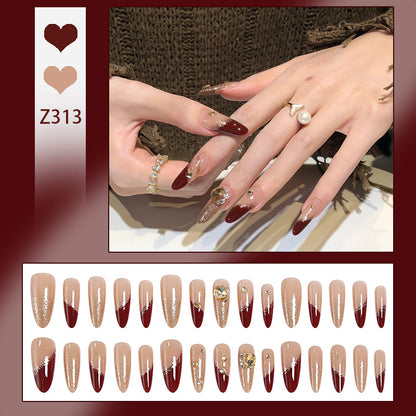 Acrylic nail set with elegant glitter design and exclusive embellishments Acalora