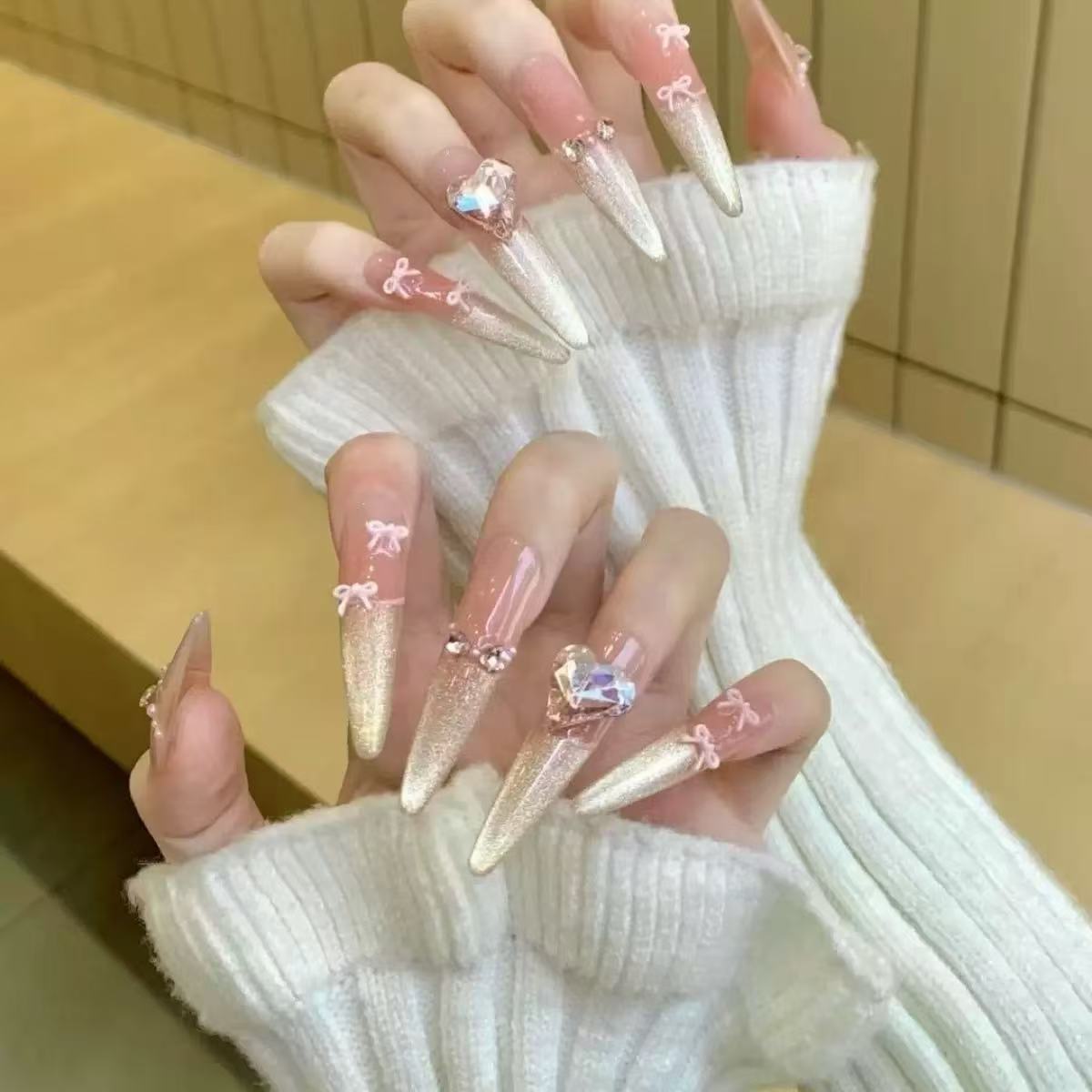 Glamorous artificial nail tips with elegant decorations Acalora
