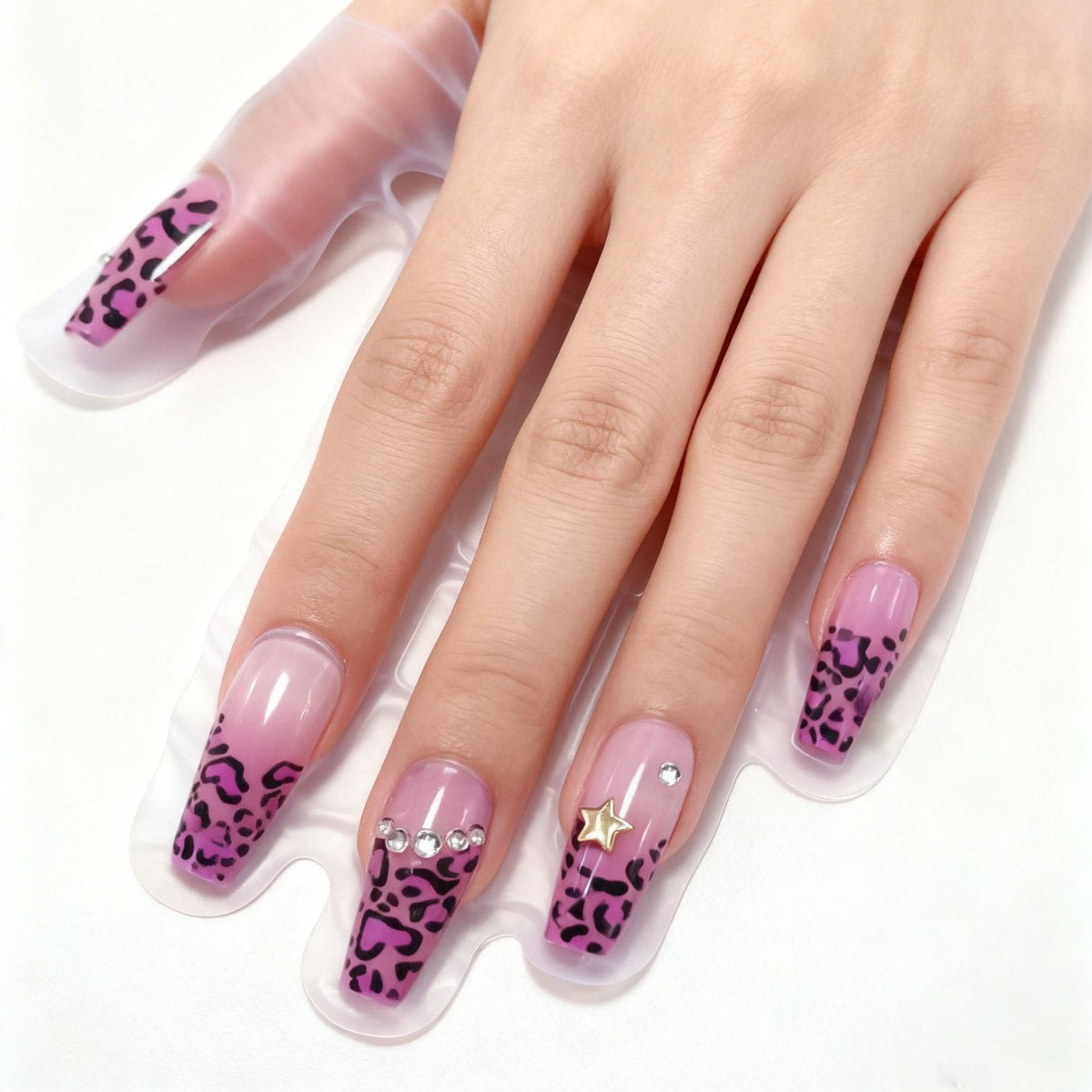 Artificial nails in a playful flower design with glittering accents Acalora