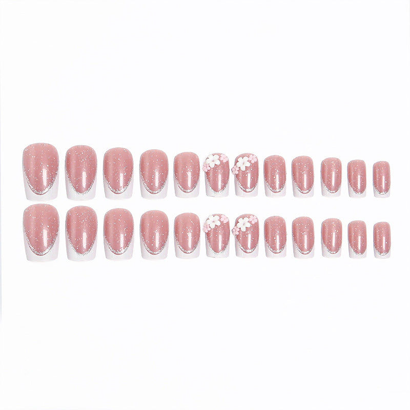 Acrylic nail set with elegant French tip and delicate floral decorations Acalora