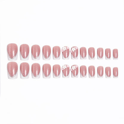 Acrylic nail set with elegant French tip and delicate floral decorations Acalora