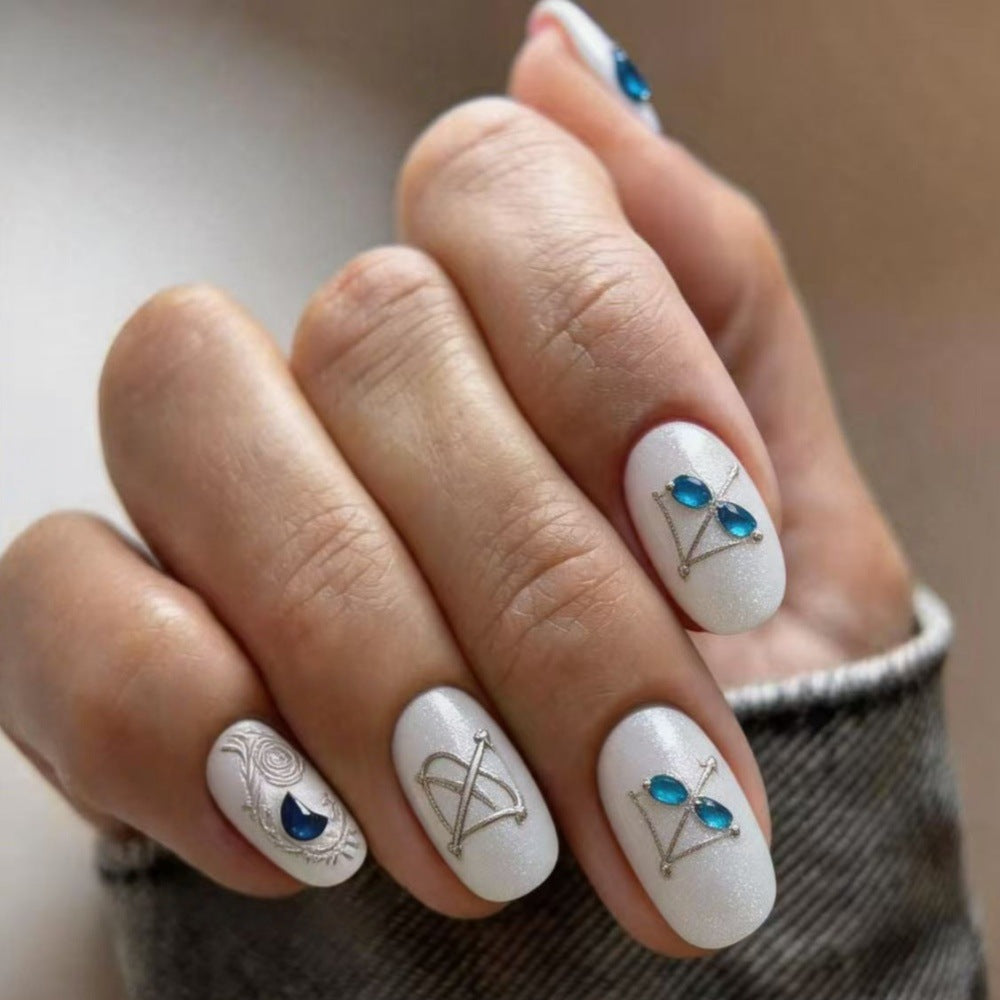 Artificial nails with elegant jewelry embellishments Acalora