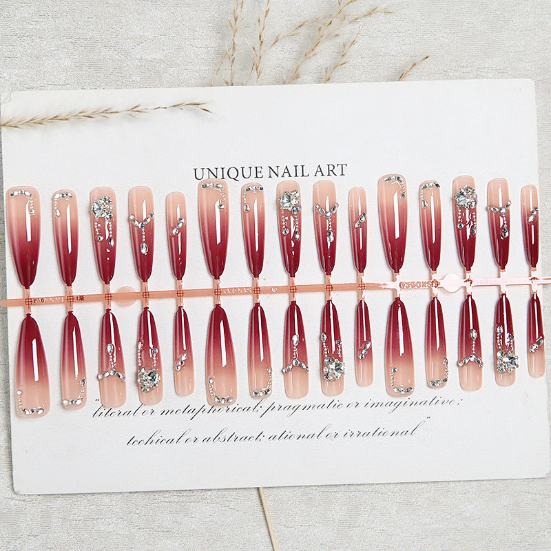 Artificial nails with elegant glitter and jewelry accents Acalora