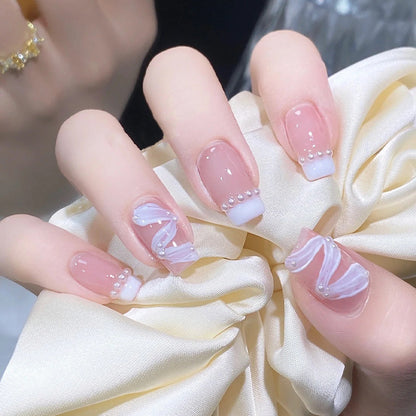 Elegant artificial nail set with stylish wave pattern and pearl accents Acalora