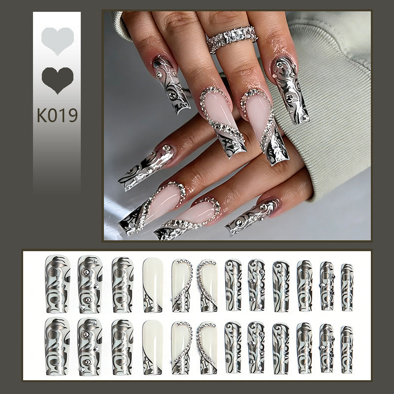 Acrylic nail set with elegant patterns and sparkling accents Acalora
