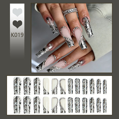 Acrylic nail set with elegant patterns and sparkling accents Acalora