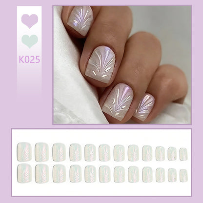 Acrylic nail set with elegant pearl details and fine floral patterns Acalora