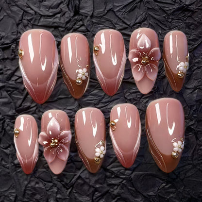 Artificial nail set with floral accents and gold embellishments Acalora