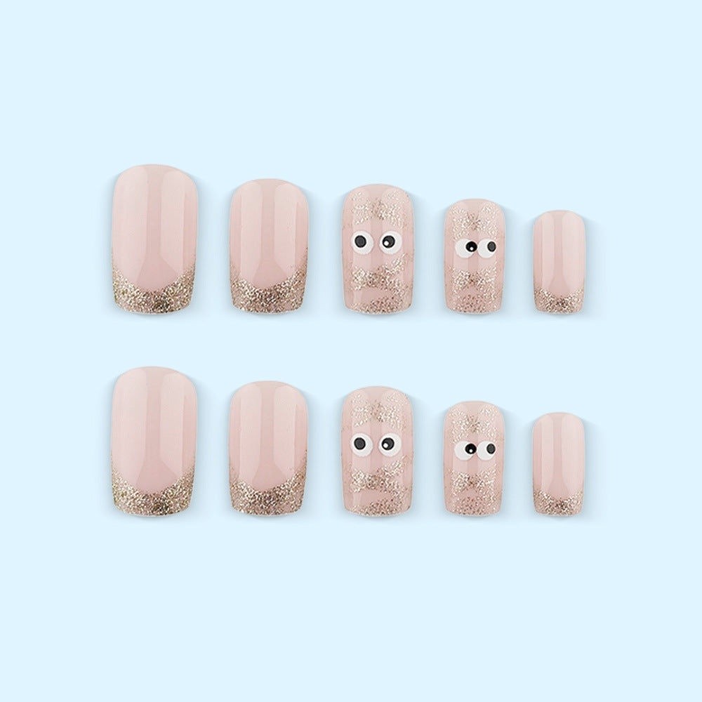 Artificials nails with playful eye design and glitter tips Acalora