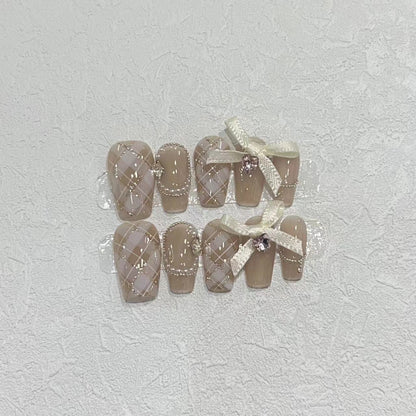 Elegant Press-On Nail Art Set with Ribbons and Gemstone Accents Acalora