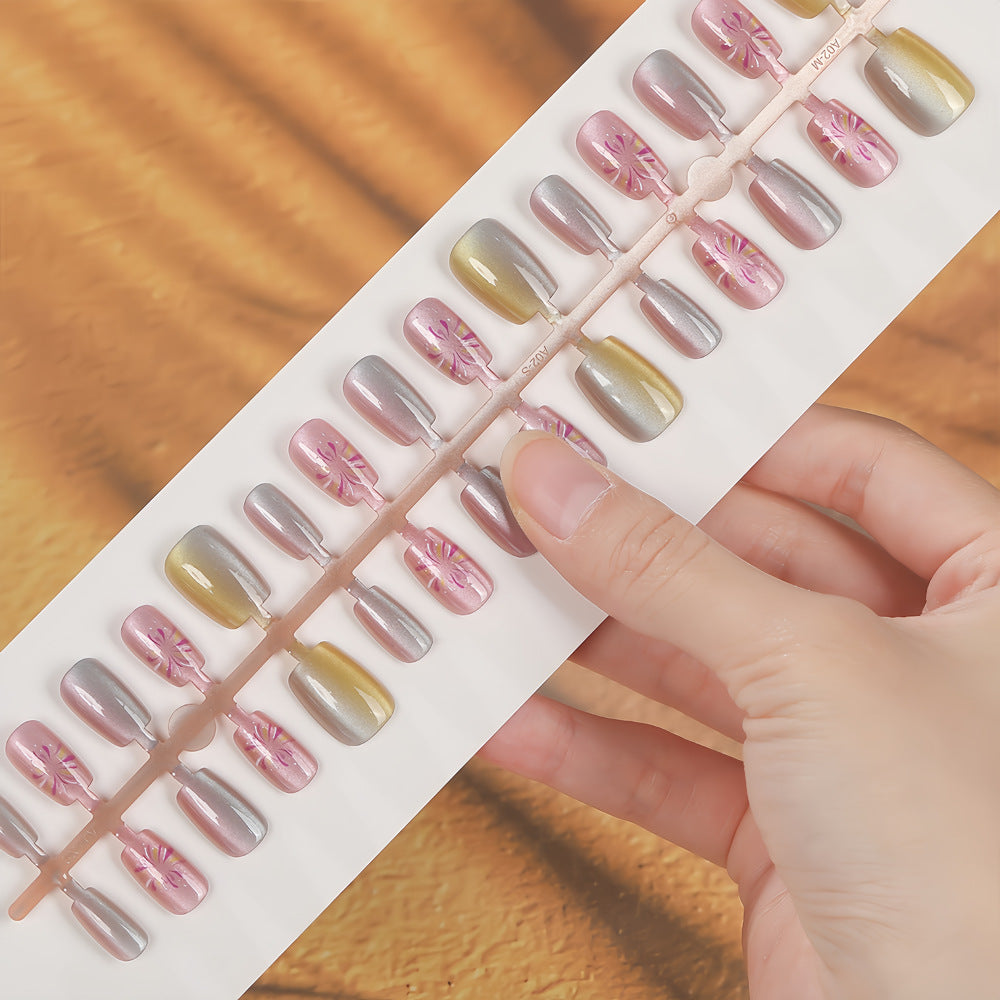 Artificial nails in modern ombre design with floral accents Acalora